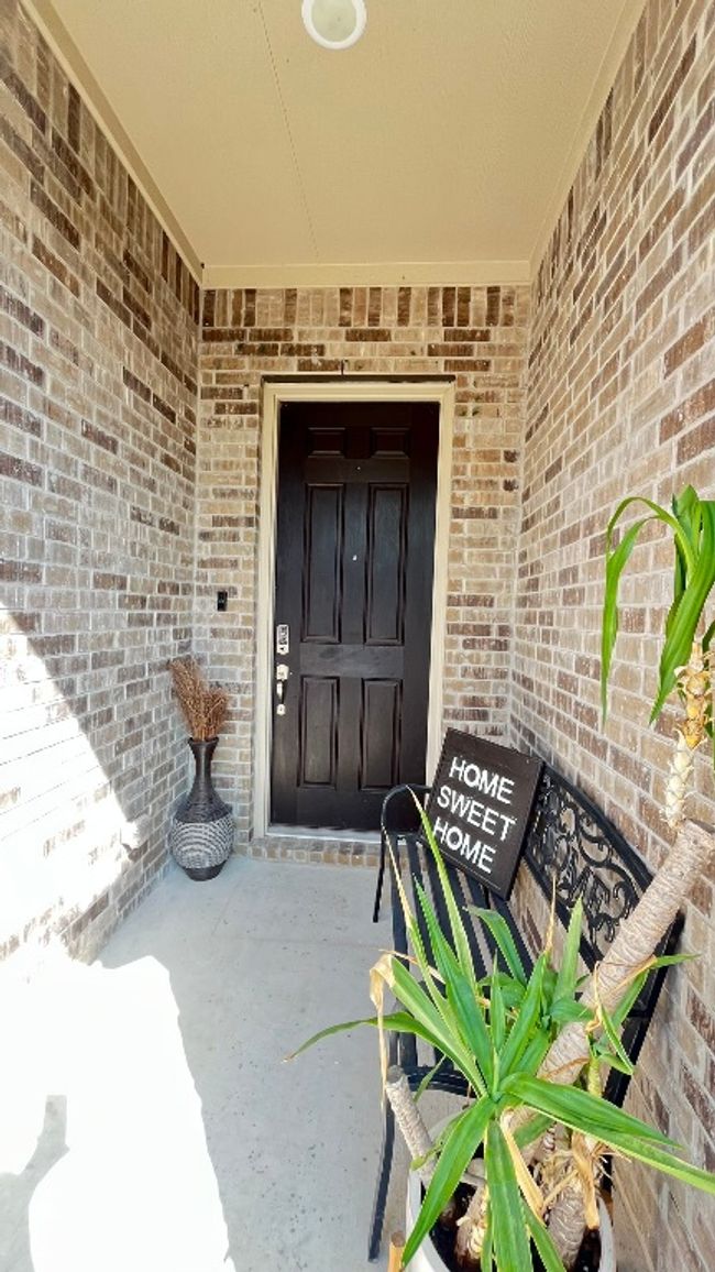 Property entrance with brick siding | Image 5