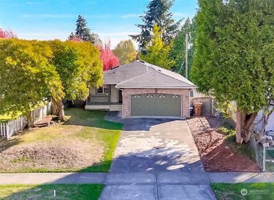 Dialed-in rambler on a tree-lined street - this home was built in 1995. | Image 1