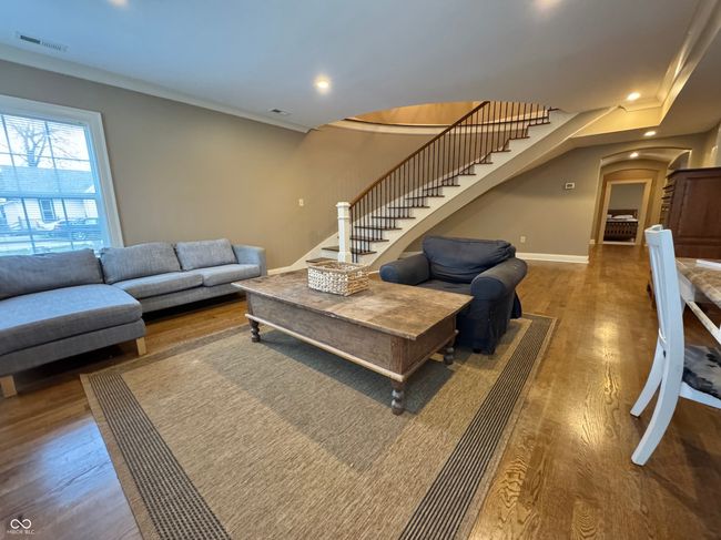 GREAT ROOM FEATURING CURVED STAIRCASE | Image 5