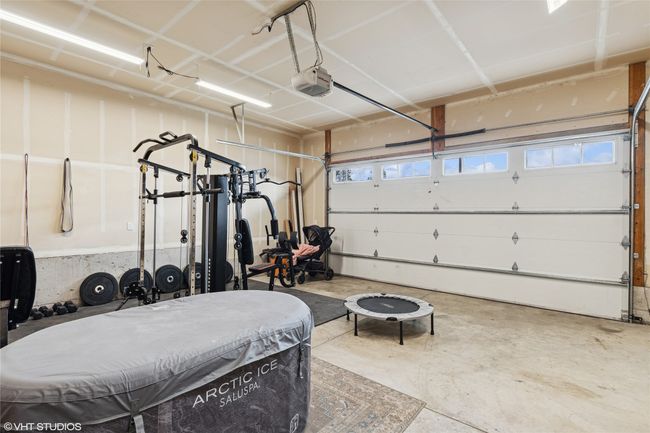 Garage with a garage door opener | Image 32