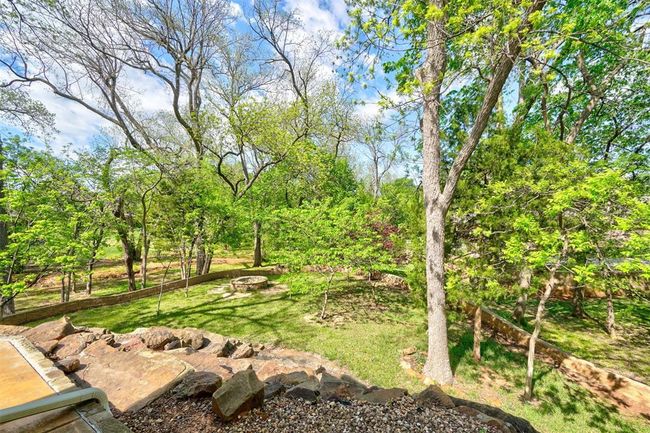 View of yard featuring an outdoor fire pit | Image 46