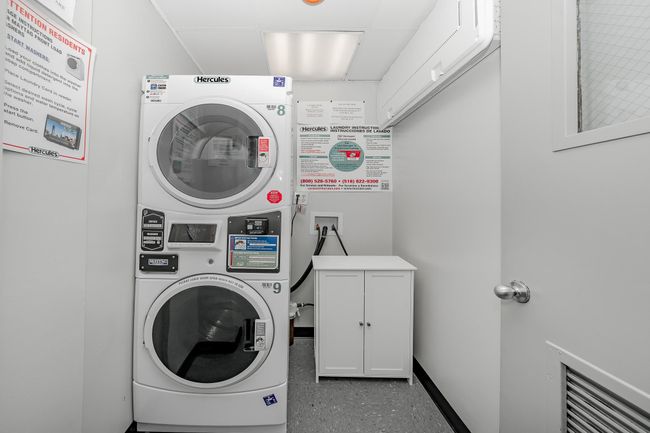 Laundry room and stacked washer and clothes dryer | Image 23