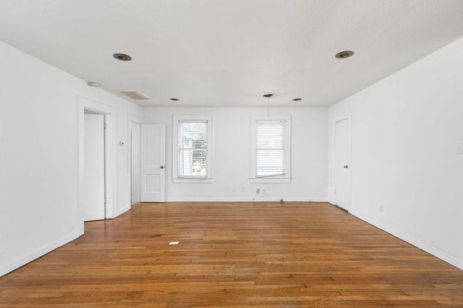 Empty room featuring light wood-style floors and baseboards | Image 30