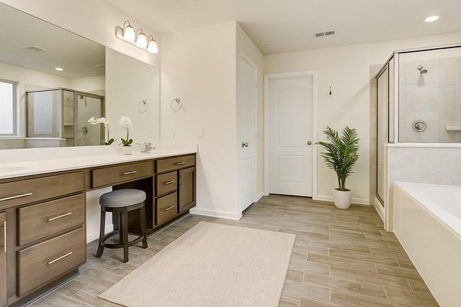 The primary ensuite has a separate tub and shower and very large walk-in closet! | Image 15