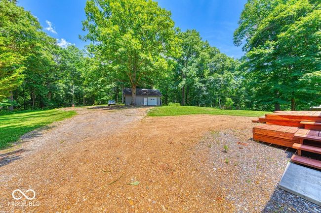 view of yard featuring a wooden deck and a storage shed | Image 61