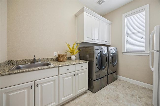 Great sized Laundry Room with sink, extra fridge, washer and dryer (all included) | Image 25