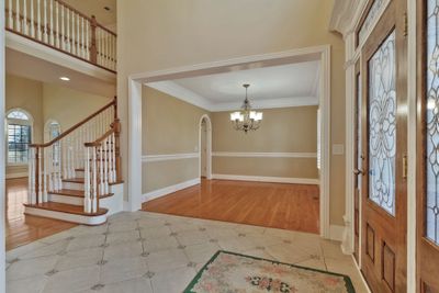 Foyer is open to the dining room, great room, and office | Image 2