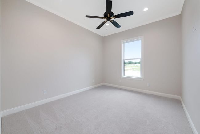 Spare room with light carpet, a ceiling fan, recessed lighting, and ornamental molding | Image 34