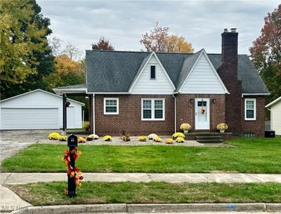 Breath taking View of front facade with a spacious front yard and a 2 car garage | Image 1