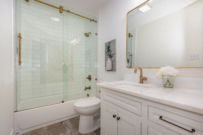 Full bathroom with vanity and enclosed tub / shower combo | Image 31