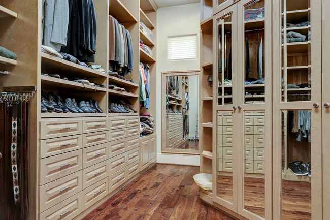One of two custom primary bedroom closets. | Image 24
