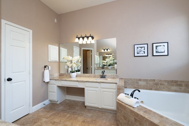 Bathroom with a garden tub and vanity | Image 20