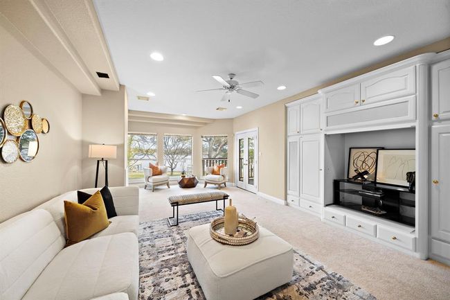Expansive living area is adjacent to the primary suite is a great place to unwind before going to bed. | Image 28