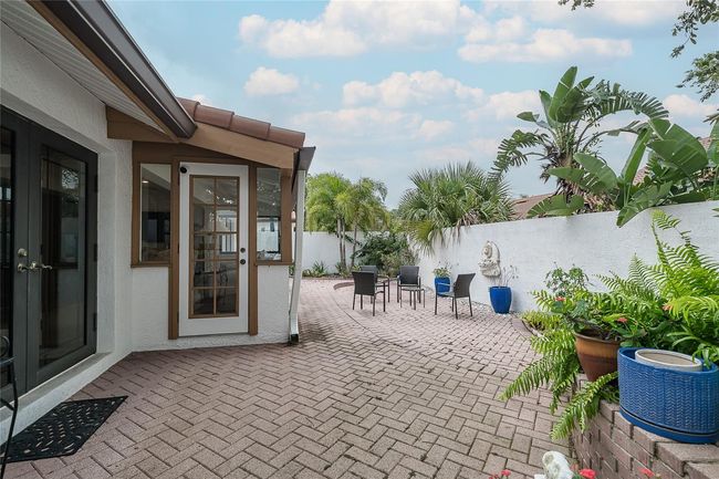 back area walled in and brick pavers | Image 29