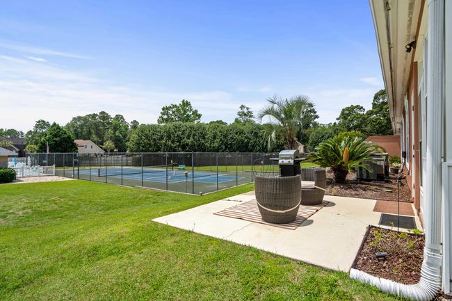 View of yard with a tennis court | Image 20