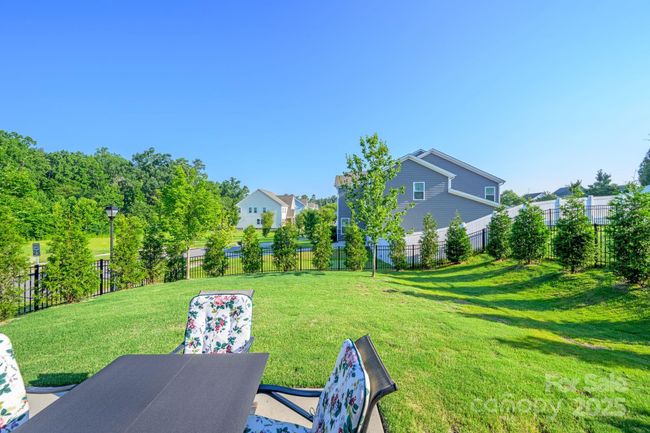Patio with plenty of space for a grill area and seating | Image 26