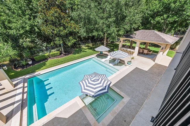 Aerial view of the back of the home from the second floor balcony. | Image 49