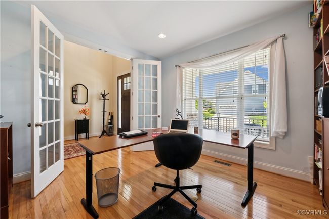 18 lite 8' French glass doors adorn the entry to the office allowing a more quiet workspace when needed. | Image 25