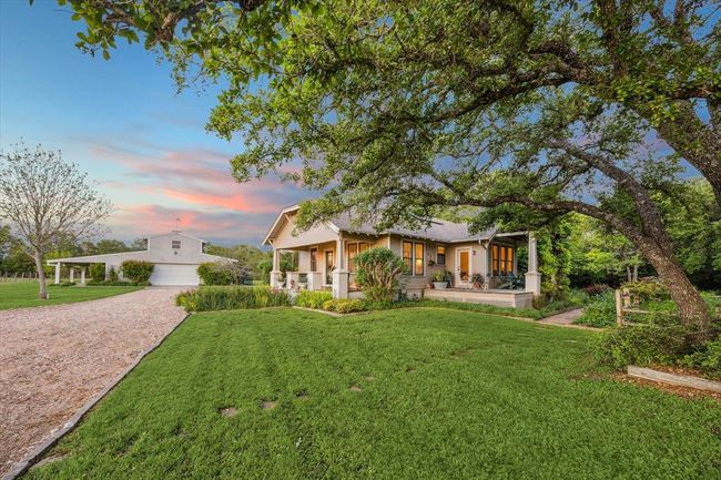View of the house and garage from the driveway entry. | Image 39