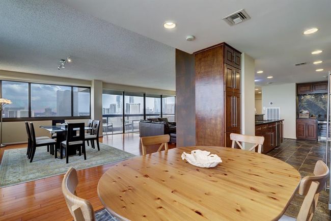 From breakfast room, this view looks out towatrd living and dining room. | Image 10
