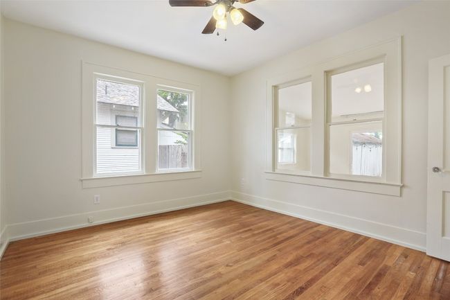 Spare room with light wood-type flooring and a ceiling fan | Image 18