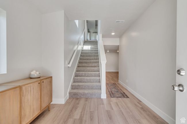 Staircase with wood finished floors and baseboards | Image 14