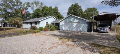 View of front of home featuring a garage and a carport | Image 2