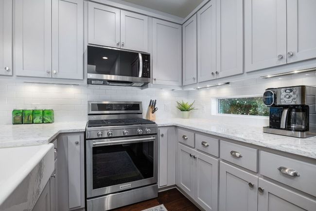 Stylish cabinetry offers ample storage. | Image 21
