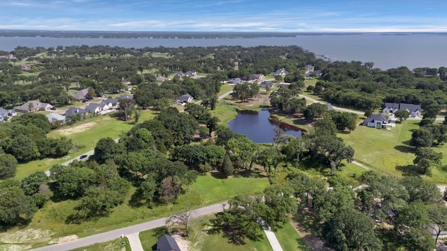 Aerial perspective of suburban area featuring a nearby body of water | Image 21
