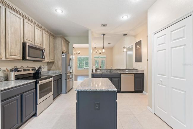 11933 Pasco Trails Blvd, House other with 4 bedrooms, 3 bathrooms and null parking in SPRING HILL FL | Image 10