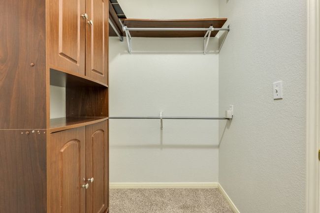 Walk in closet with carpet | Image 26
