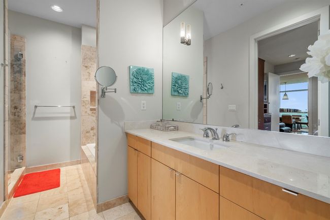 Bathroom featuring tiled shower, vanity, and recessed lighting | Image 6