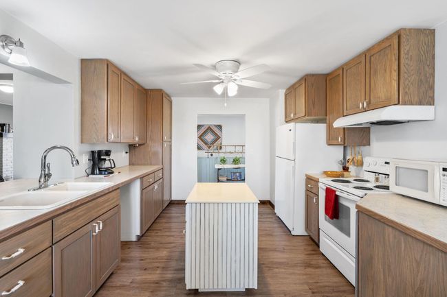 Custom cabinets in the kitchen and the island stays! | Image 17