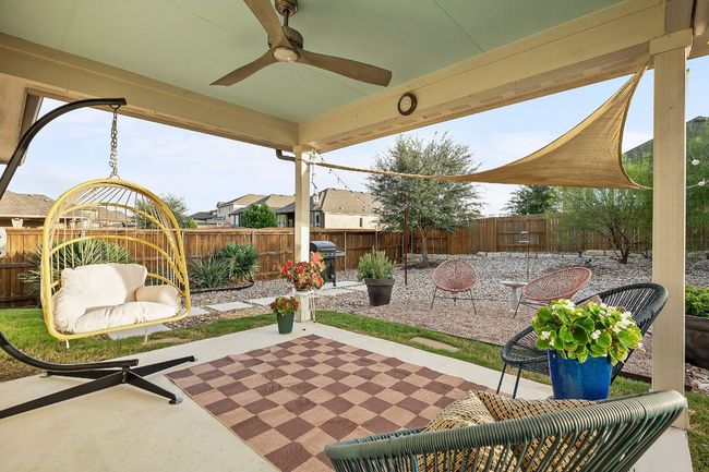 A covered patio provides shade and year-round usability. | Image 22