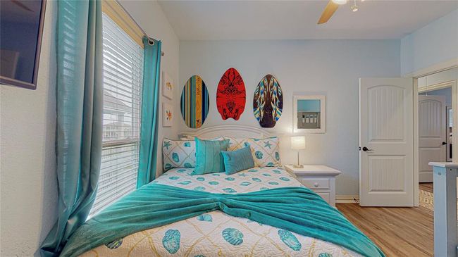 Large guest room perfect for hosting visitors or as "the kids' room!" This spacious area easily accommodates a queen-size bed and large bunk beds, making it ideal for family or friends. | Image 27