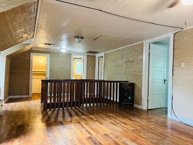 Additional living space with hardwood / wood-style flooring, wood ceiling, and ceiling fan | Image 23
