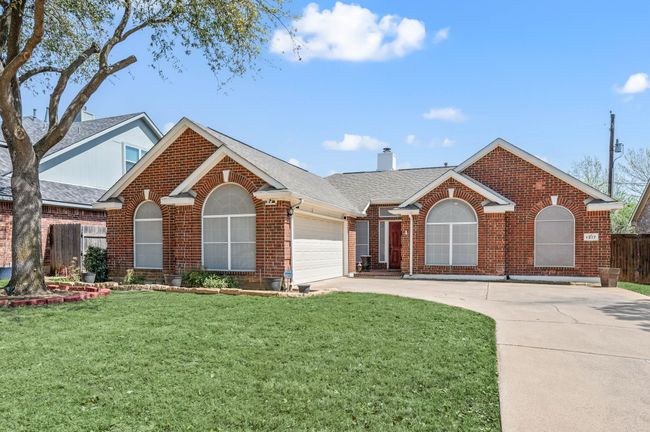 Ranch-style home featuring roof with shingles, brick siding, driveway, and fence | Image 40