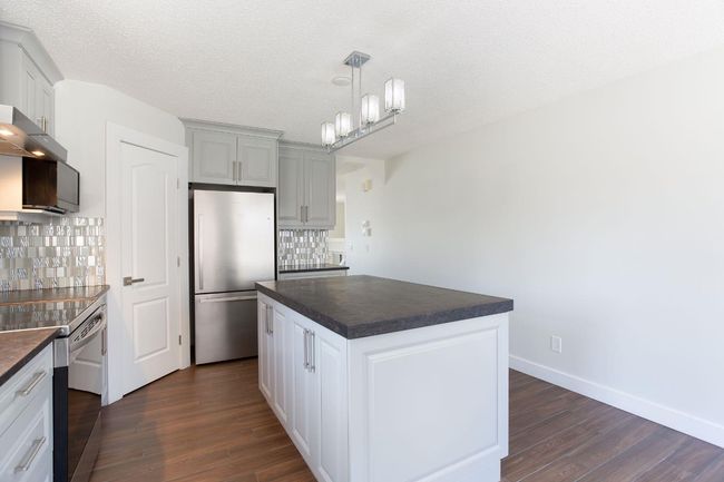 432 Rocky Ridge Drive Nw, House other with 5 bedrooms, 3 bathrooms and 4 parking in Calgary AB | Image 9