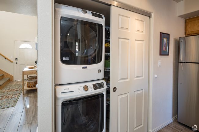 Laundry room featuring stacked washer / dryer | Image 18