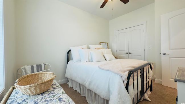 Carpeted bedroom featuring a closet and ceiling fan | Image 7