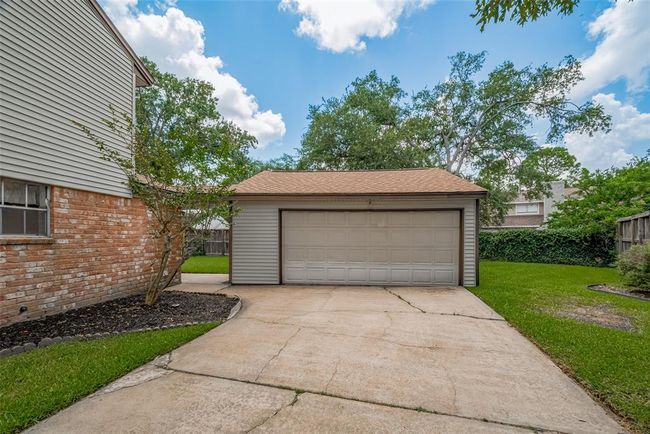 Spacious 2-car garage with convenient automatic door. | Image 32