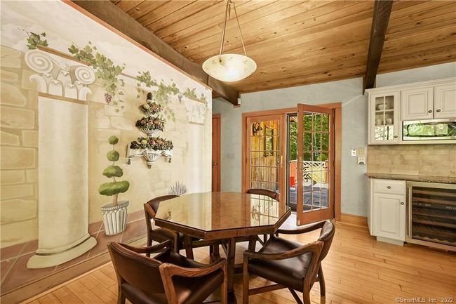 Eat-in kitchen area looking towards back yard french doors to deck | Image 28