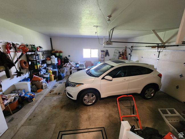 Garage featuring a garage door opener | Image 46