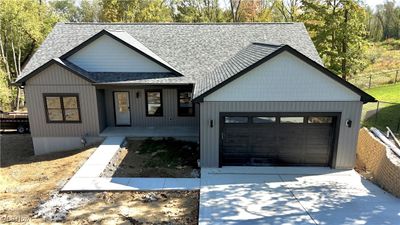 Modern farmhouse with a garage | Image 1