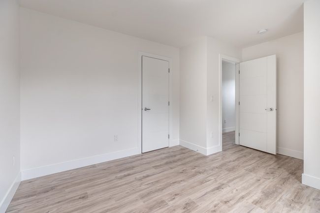 Unfurnished bedroom featuring light wood-style flooring and baseboards | Image 20