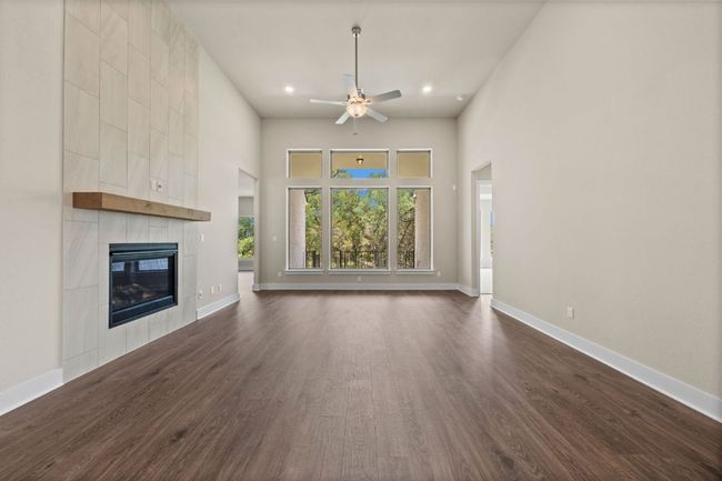 Family Room with elevated ceiling & fireplace | Image 15
