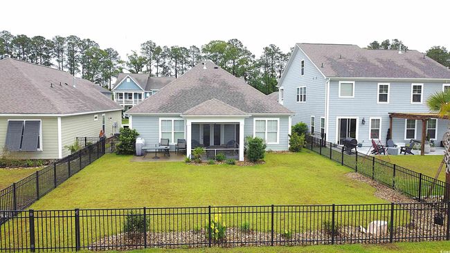 Rear view of property featuring a patio area | Image 17