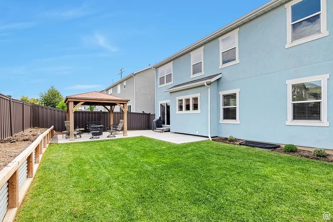 Back of property featuring a gazebo, a patio, and stucco siding | Image 28