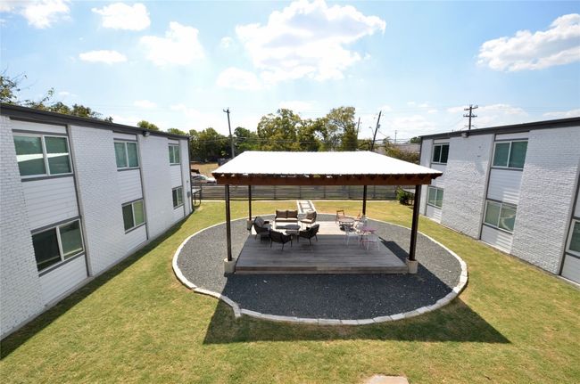 View of yard featuring a wooden deck and an outdoor living space | Image 15