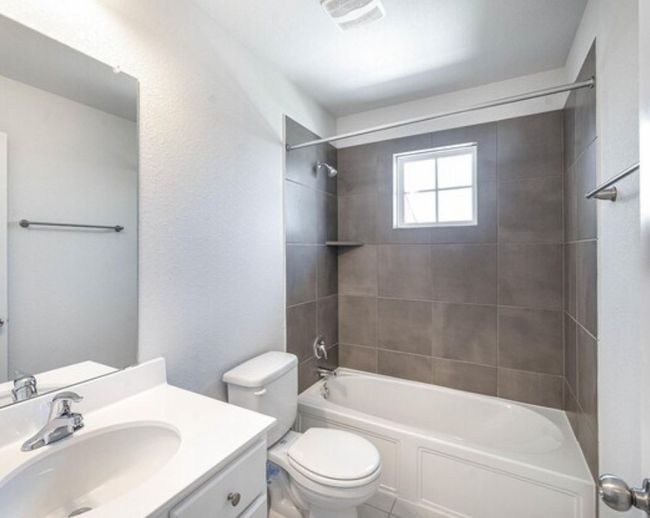 Full bathroom with vanity, shower / washtub combination, and tile patterned floors | Image 16